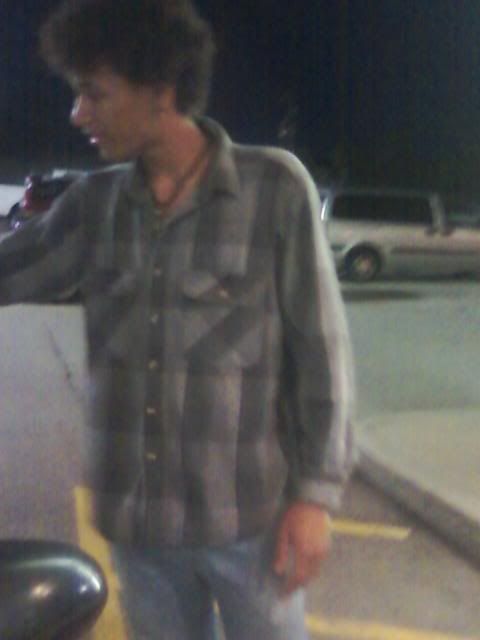 thats josh. singing to mah mommy. :D (his fro looks silly.)